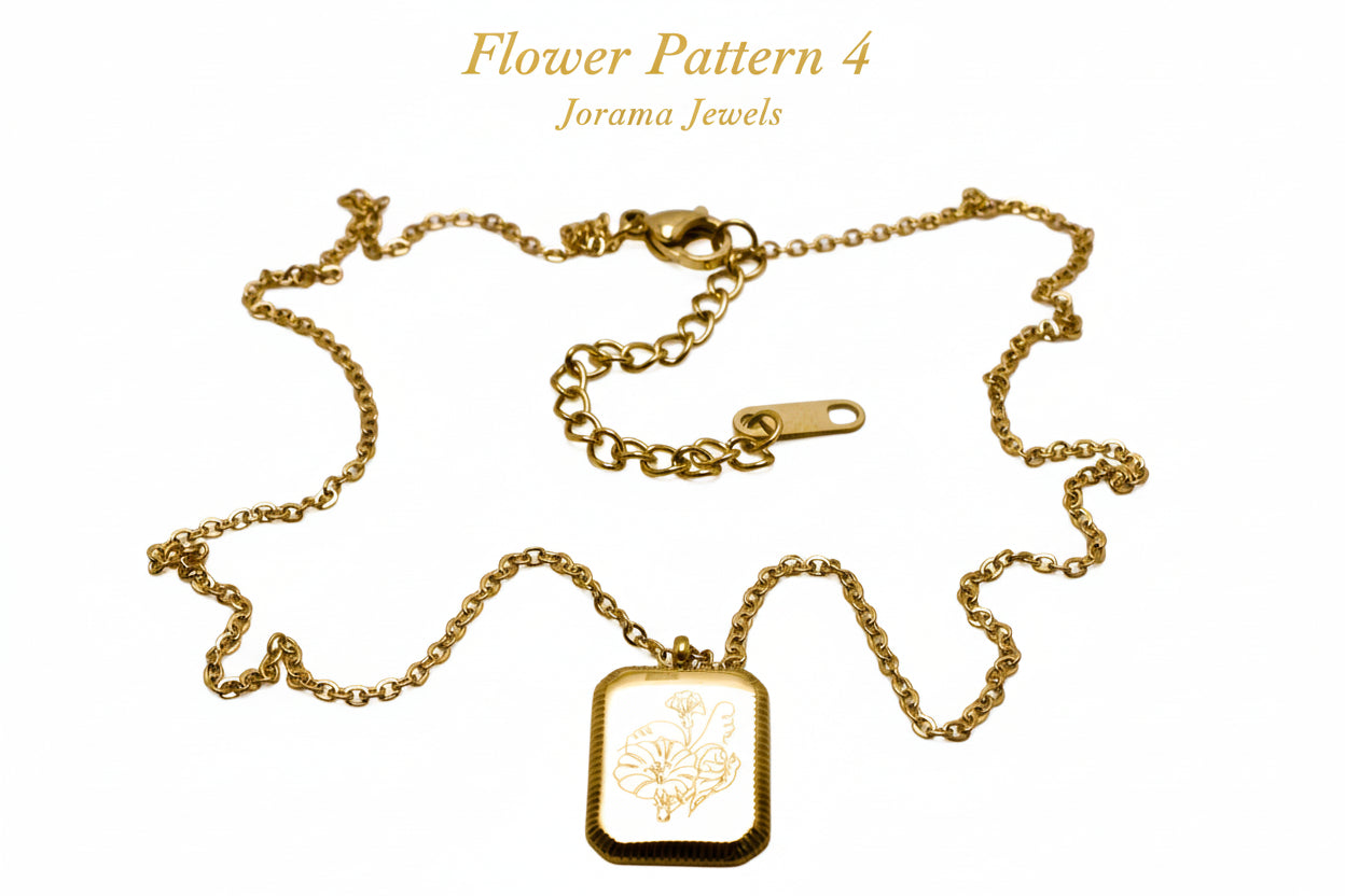 Gold necklace with a rectangular pendant on a light white background