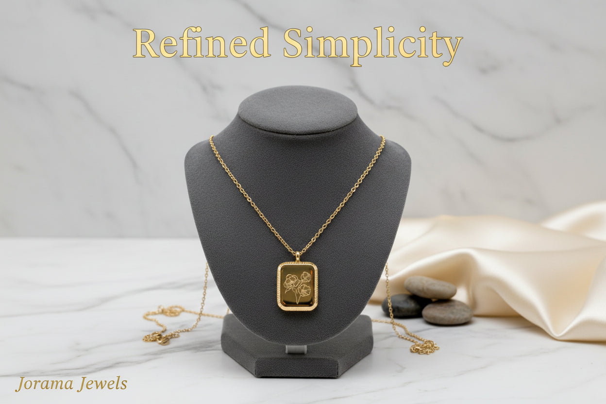 A gold-colored square flower pendant necklace displayed against a white background.