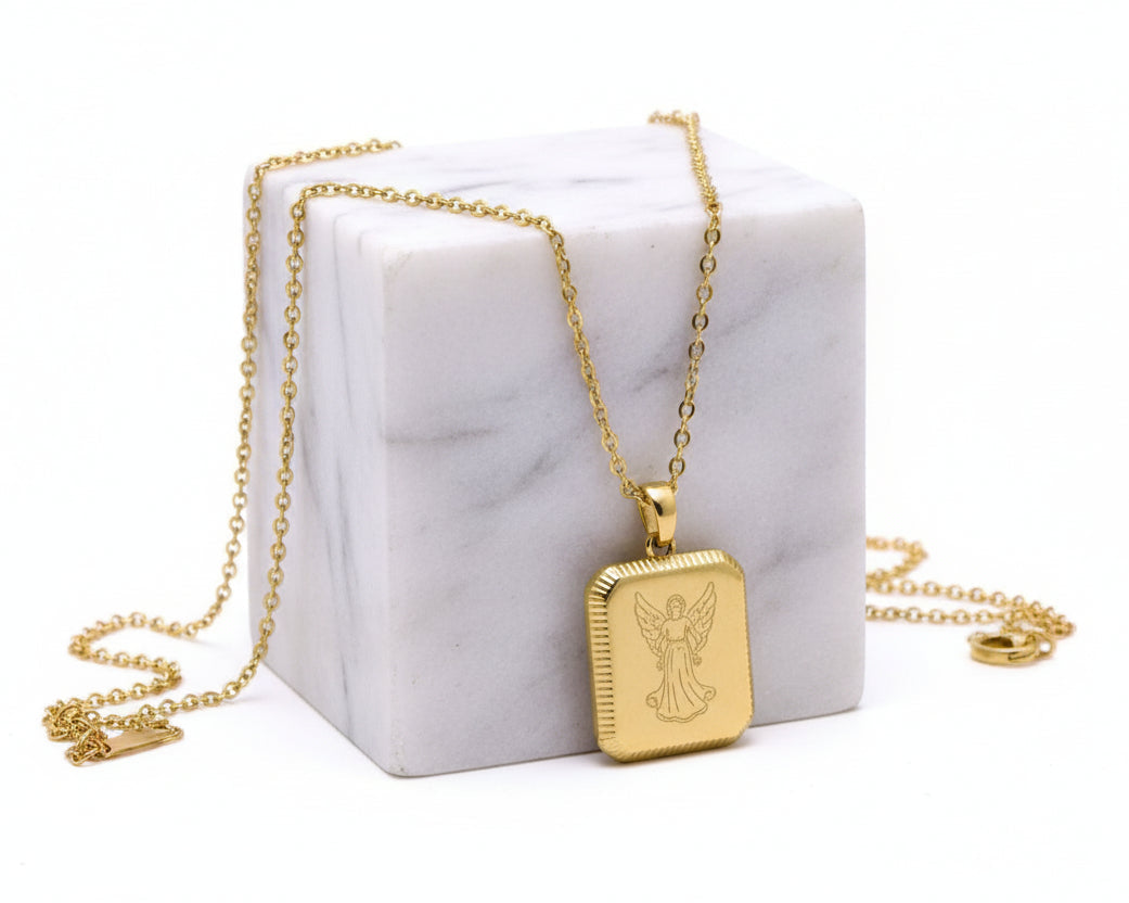 A gold-colored square flower pendant necklace is displayed against a white background.
