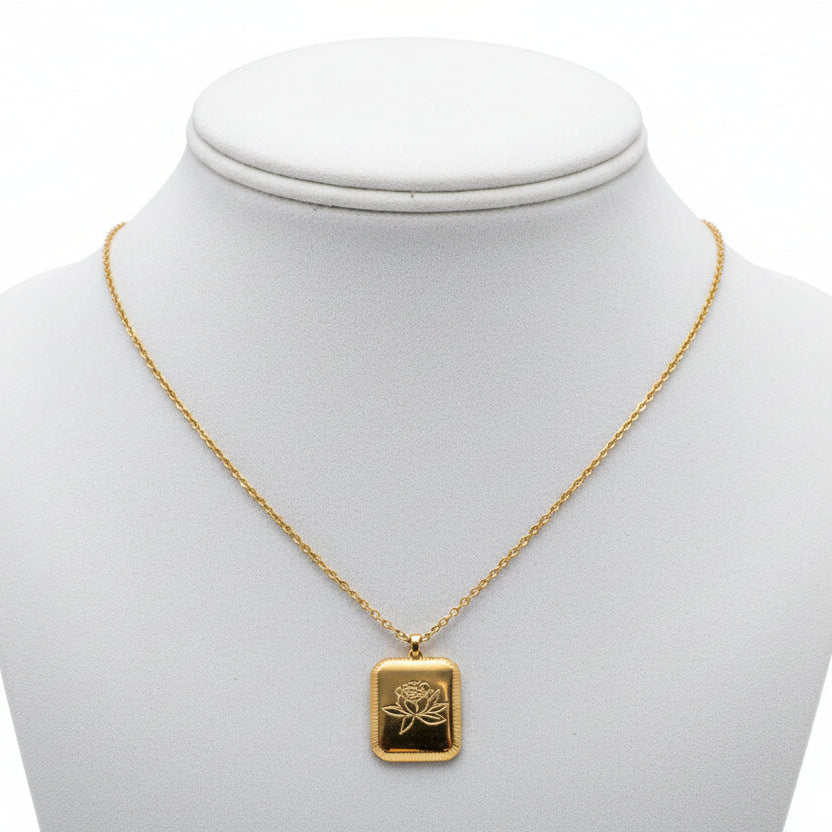 Gold bracelet with a tag on a white background